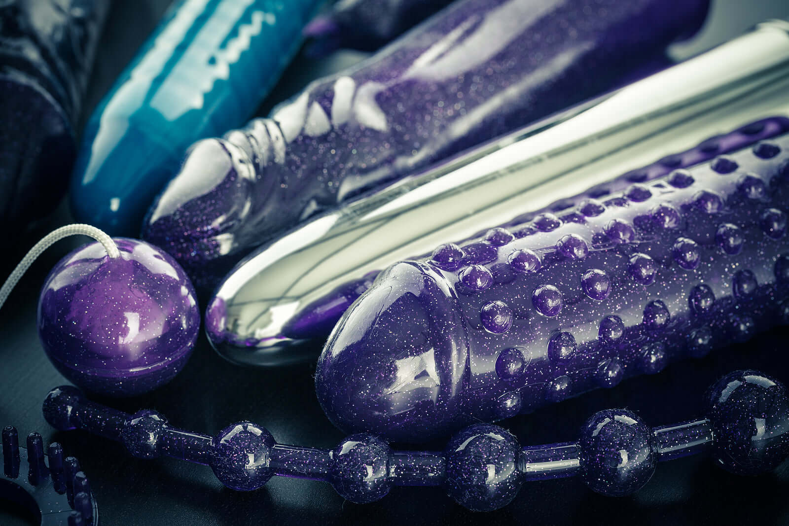 Dildos, Dongs & Strap-On Harnesses collection featuring colorful dildos and adult toys for intimate essentials.
