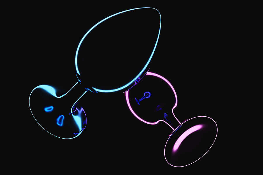 Anal Toys & Anal Essentials featuring glowing butt plugs in blue and pink colors.