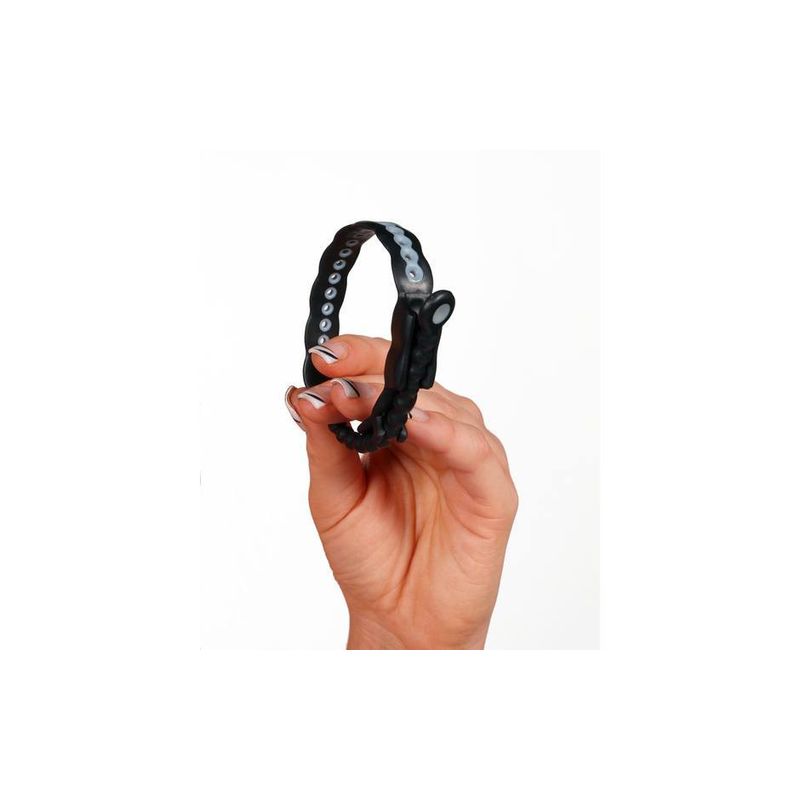 Hand holding the Speed Shift Black adjustable ring, showcasing its quick release tab and size adjustments.