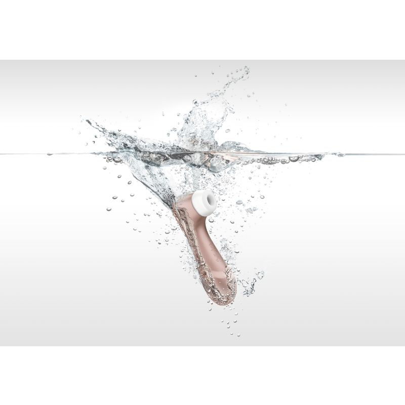 Satisfyer Pro 2 G2 Air Pulse Clitoral Stimulator Rose Gold splashing in water, a clitoral stimulator with pressure wave stimulation.