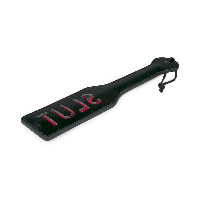 Punishment paddle for couples with a black finish and red inscription, designed for playful spanking sessions.