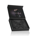 Faux leather hogtie displayed in box with 'Live Your Fantasy' text for bondage play.