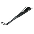 Leather flogger whip with a sleek handle and multiple strands for BDSM play.