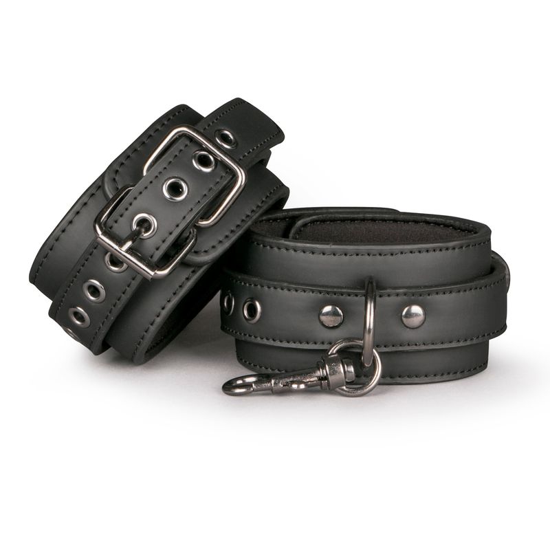 Black ankle cuffs for bondage with adjustable strap and metal chain for control and versatility.