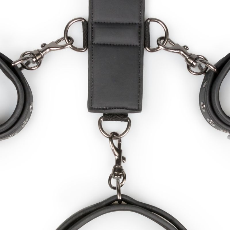 bondage neck and wrist restraints featuring faux leather cuffs and adjustable harness strap with D-rings.