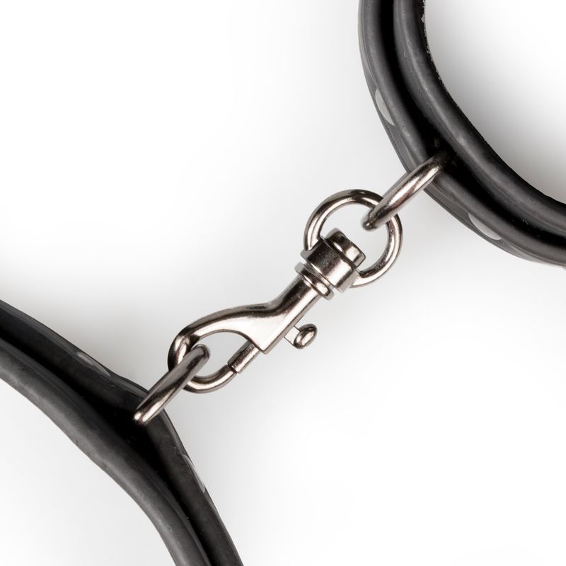 Close-up of clip fastener on BDSM thigh and wrist cuff set, showcasing strong and durable faux leather material.