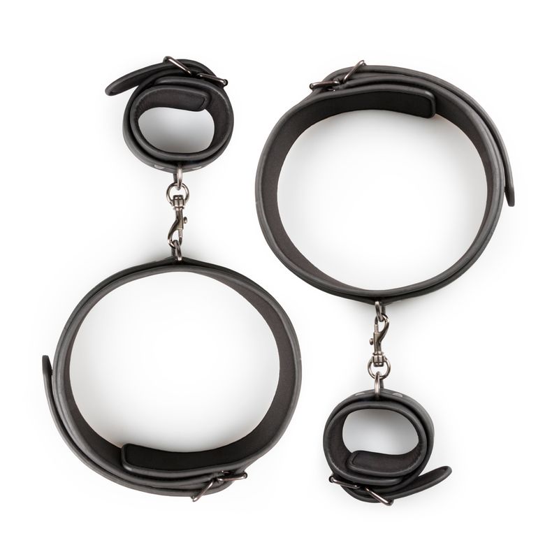 BDSM thigh and wrist cuff set featuring durable faux leather cuffs with foam lining and clip fasteners.