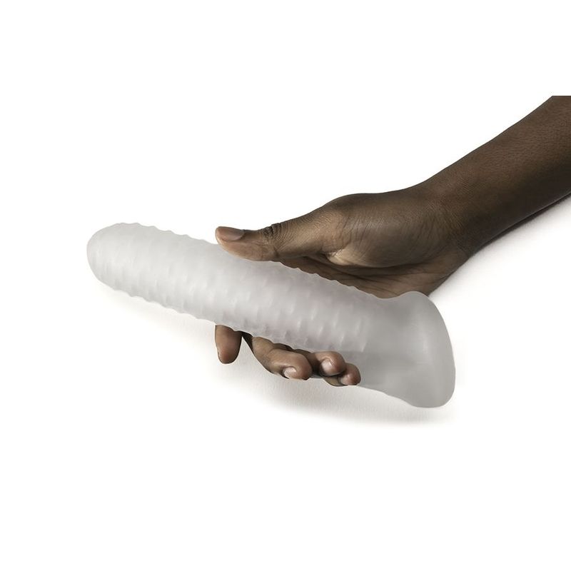 A hand holding a translucent, textured silicone dildo designed for pleasure.
