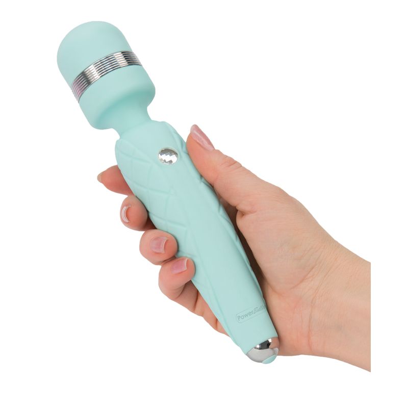 Pillow Talk Cheeky Teal wand held in hand, showcasing its luxurious design and comfortable grip.