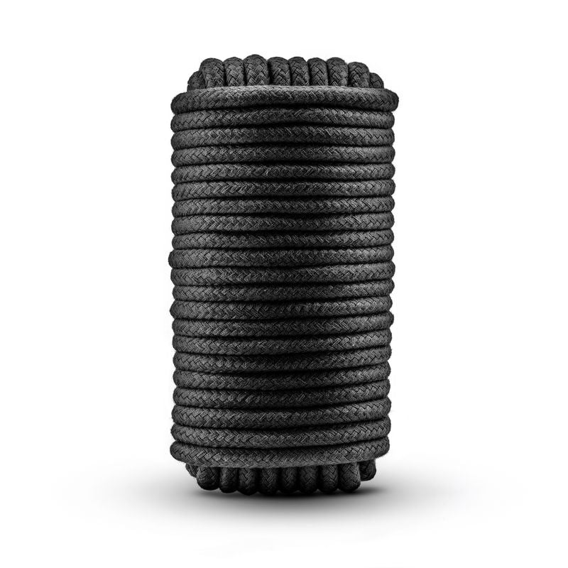 Temptasia Bondage Rope 10m Black rolled for intimate essentials and sensual play in the bedroom.