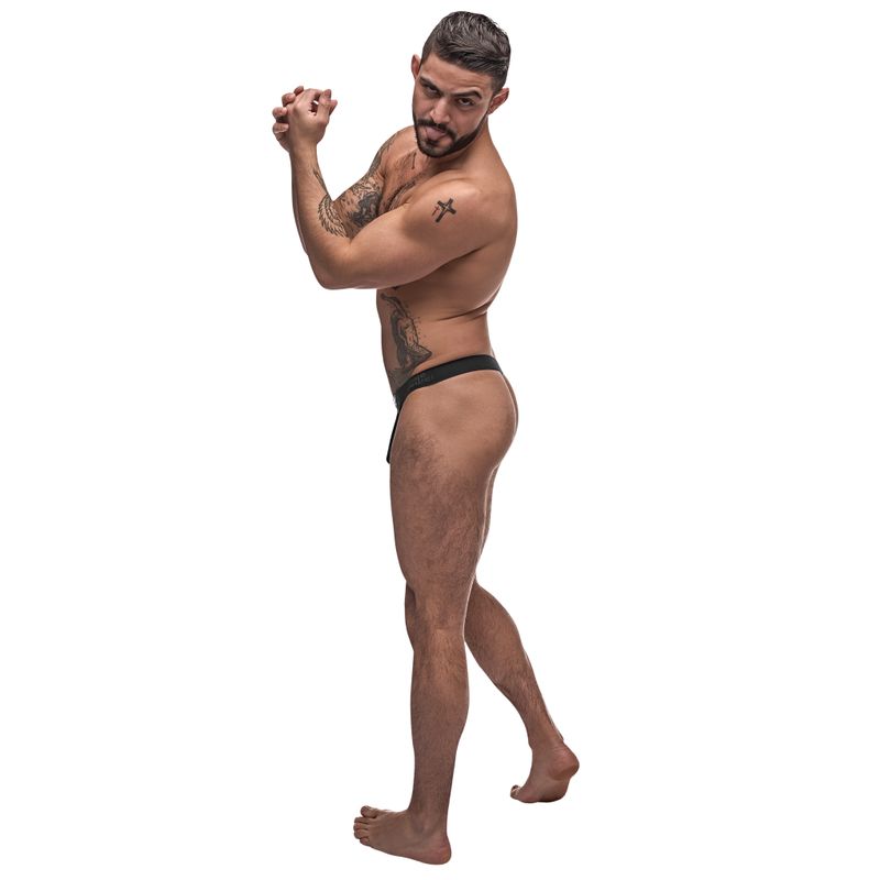 Male model showcasing the men's rip off thong from Male Power's Grip & Rip collection, featuring a breakaway front pouch.