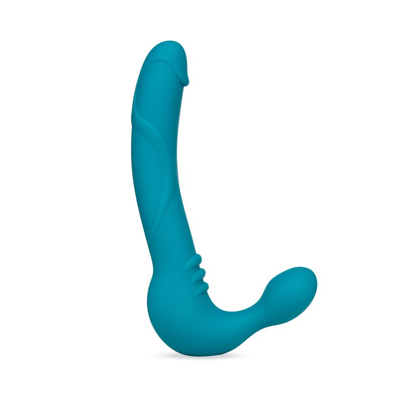 Temptasia Luna strapless silicone dildo with vibrating bullet in teal color, featuring a gently textured shaft and a rounded bulb.