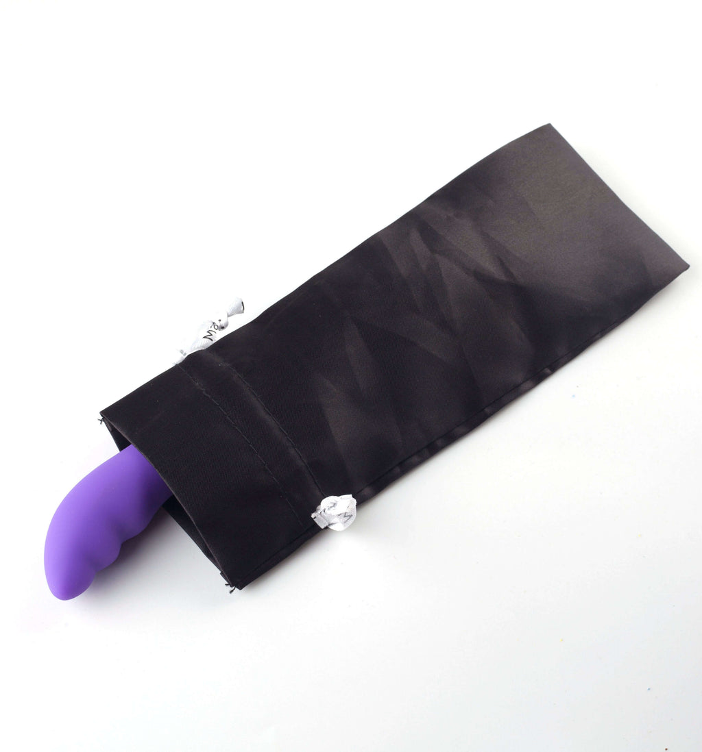 USB rechargeable rabbit vibrator nestled in a sleek black storage pouch, featuring vibrant neon purple silicone.