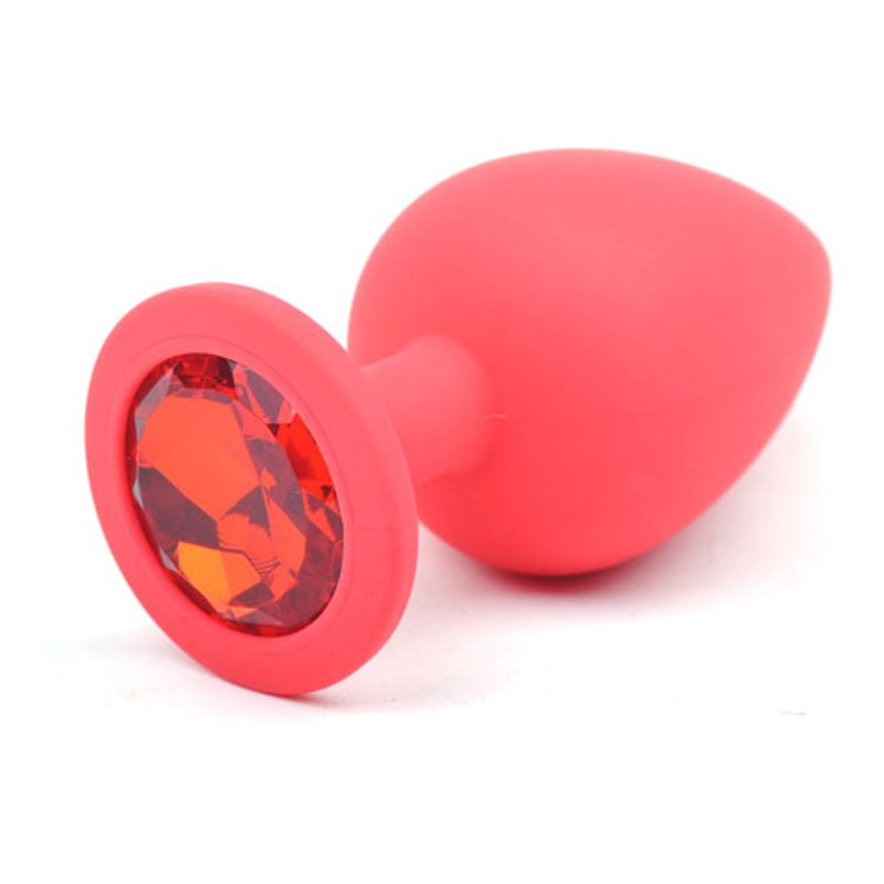Large red silicone anal plug featuring a sparkling red diamond for pleasure and style.