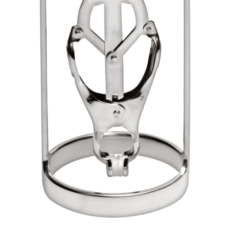 Close-up of a stainless steel nipple stretcher with clover clamp mechanism.
