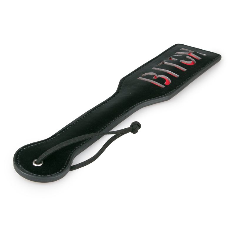 Paddle Bitch Black, a leather paddle for playful punishment, featuring a bold red inscription for intimate moments.