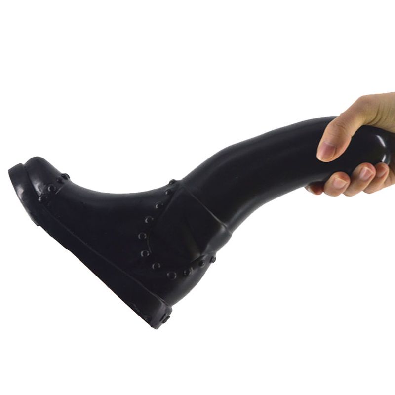 Boot Dildo Black held in hand, designed for realistic sensation, perfect for intimate essentials for her.