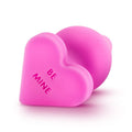 Naughty candy heart plugs in pink silicone with the text 'BE MINE' for playful and fun intimacy.