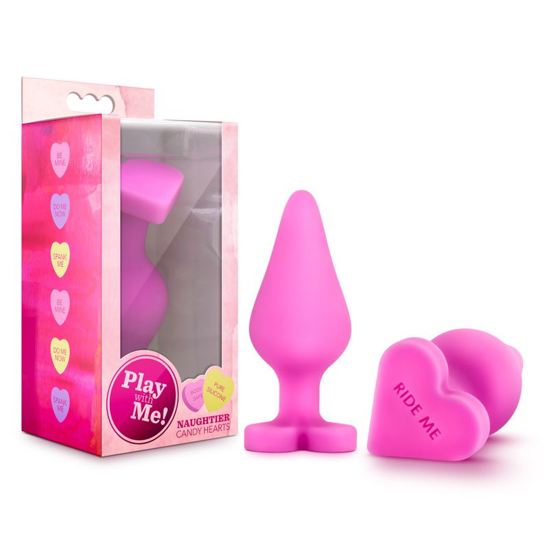 Naughtier Candy Heart Ride Me heart shaped butt plug with packaging, showcasing its playful design.