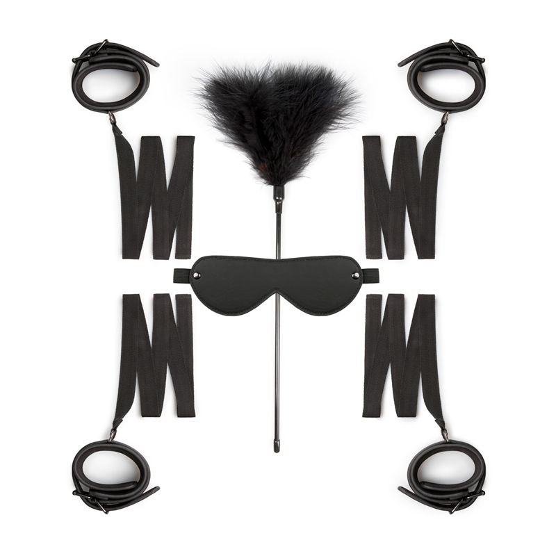 Beginners bondage kit featuring handcuffs, ankle cuffs, eye mask, and tickler on a white background.