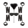 Beginners bondage kit featuring handcuffs, ankle cuffs, eye mask, and tickler on a white background.
