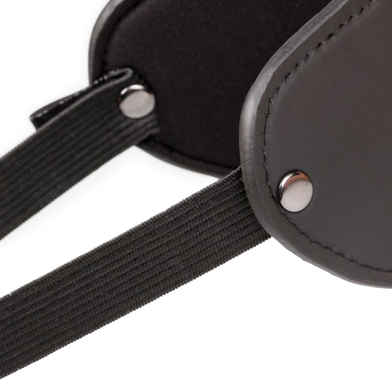 Close-up of a soft eye mask from the beginners bondage kit, showcasing its adjustable straps and comfortable design.
