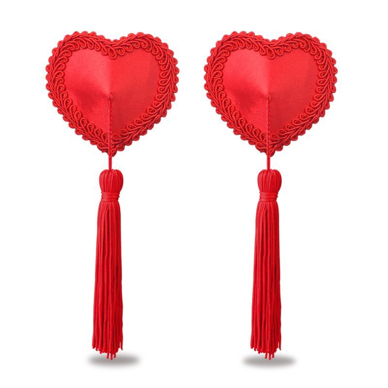 Reusable heart nipple pasties with red lace edge and tassels, perfect for sexy outfits or nipple cover ups.