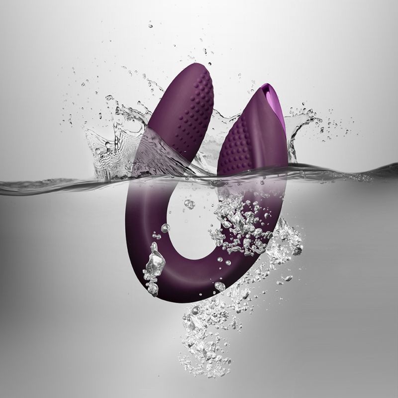Rock Chick Diva purple vibrator submerged in water, showcasing its sleek design and ergonomic features for ultimate pleasure.