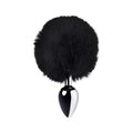Silver anal plug with black tail featuring a sleek metal design and fluffy black faux fur.