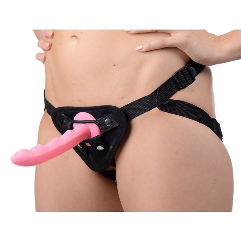 Close-up of harness with silicone dildo for harness play, showcasing its design and fit.