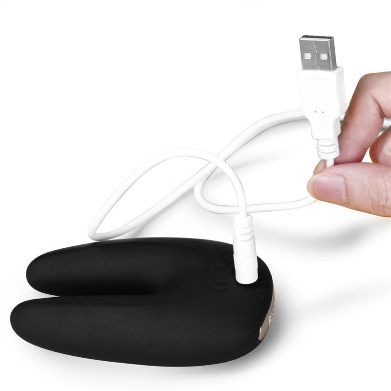 O Sensual Rapture Dual Motor Clit Massager Vibrator being charged with USB for ultimate pleasure and convenience.