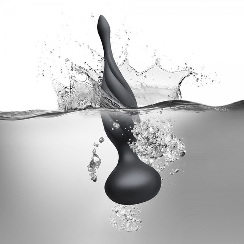 Petite Sensation Discover Butt Plug w Remote Black splashing into water, designed for intimate exploration and pleasure.