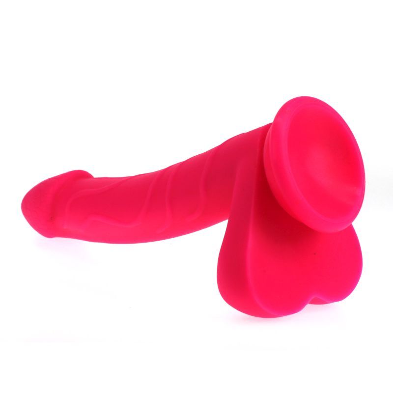 Realistic pink dildo with suction base featuring balls, made of 100% silicone, insertable length 19cm.