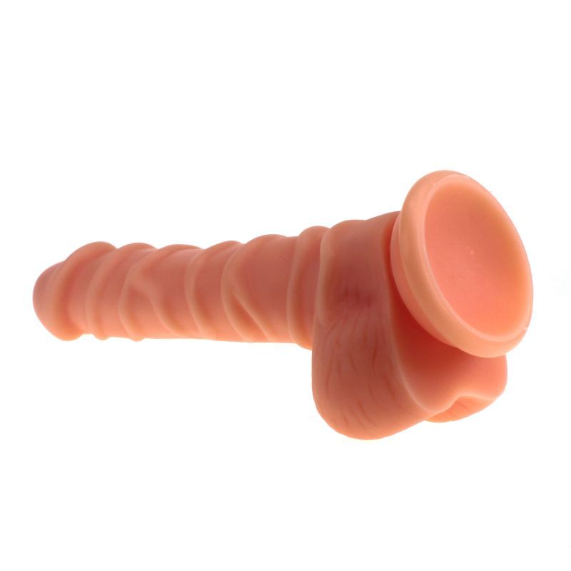 Realistic dildo with ridged shaft in flesh color, featuring a suction base and ridged design for enhanced stimulation.