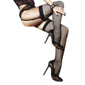 Woman wearing fishnet thigh high stockings with high heels, showcasing a glamorous look.