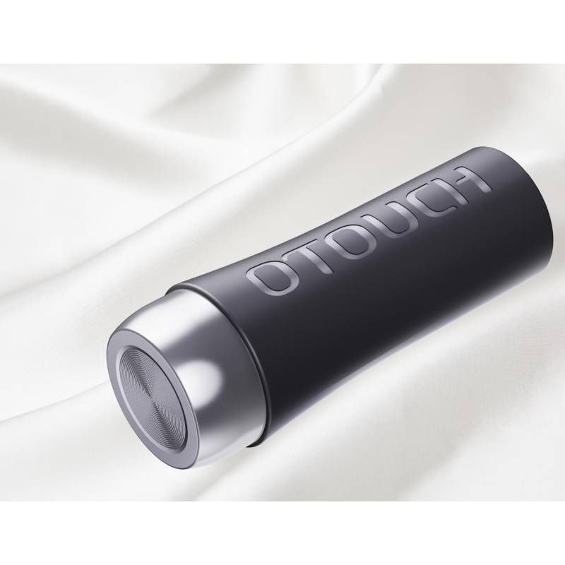 OTOUCH contracting vibrating masturbator on a soft white fabric background, showcasing sleek design and modern features.