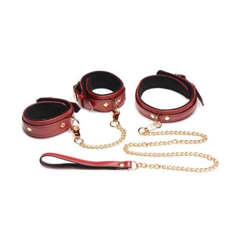 Burgundy PU leather bondage set with stylish cuffs and chains for sensual play.