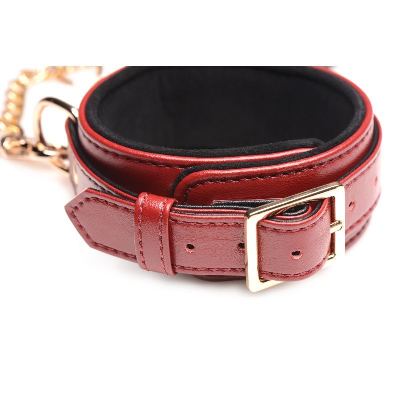 Burgundy PU leather bondage set wrist cuff with gold buckle and soft interior.