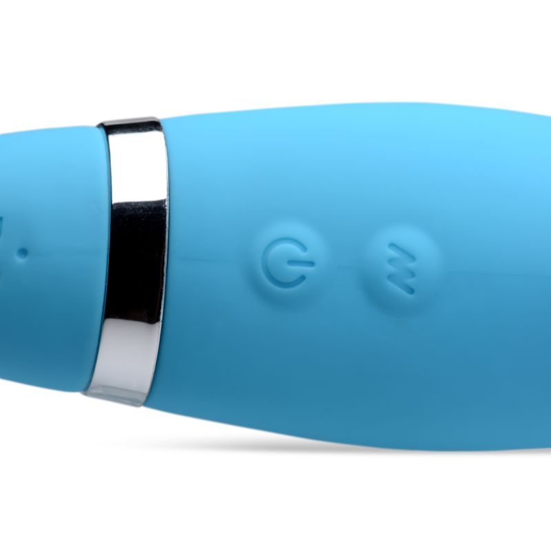 close-up of the blue Mighty Rider strapless strap-on with remote's control buttons for vibration settings