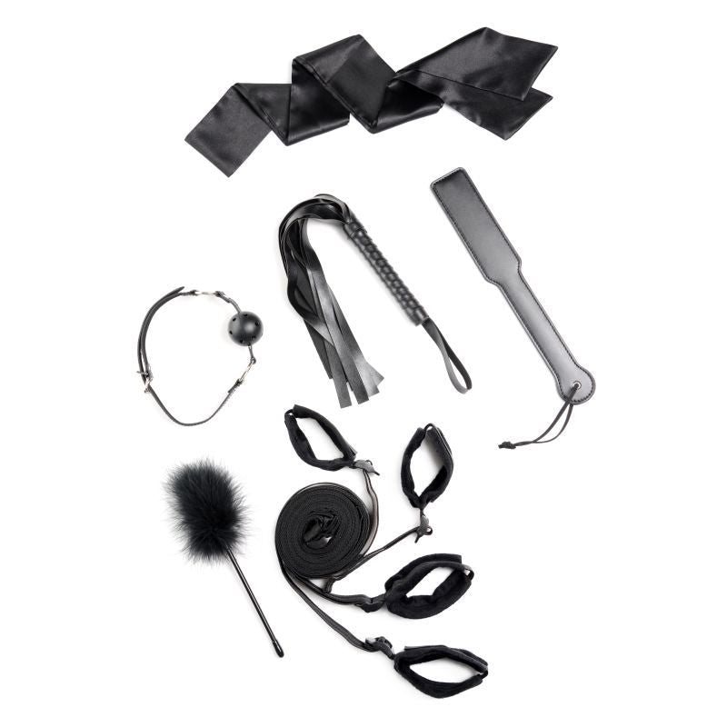 Image of Bed Restraint Bondage Kit Black featuring various BDSM accessories including restraints, paddles, and a gag.