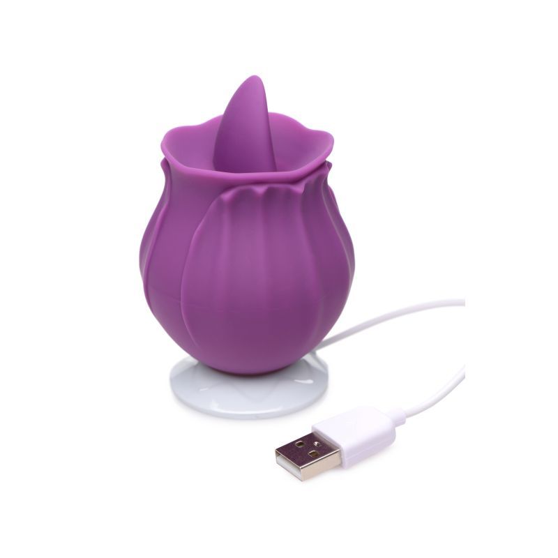 Bloomgasm Wild Violet silicone clit stimulator on a charging base, designed for pleasure and comfort.