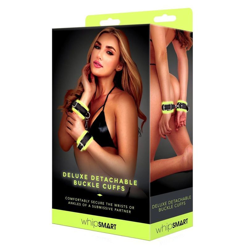 Glow In The Dark Deluxe Buckle Cuffs Black packaging showing a model with bondage cuffs. Features glow in the dark bondage cuffs.