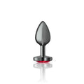 Cheeky Charms gunmetal heart jewel butt plug with red jewel, elegant design for comfortable use.