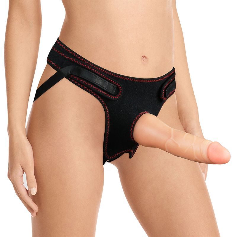 realistic strap on dildo set displayed on black adjustable harness model.