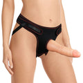 realistic strap on dildo set displayed on black adjustable harness model.