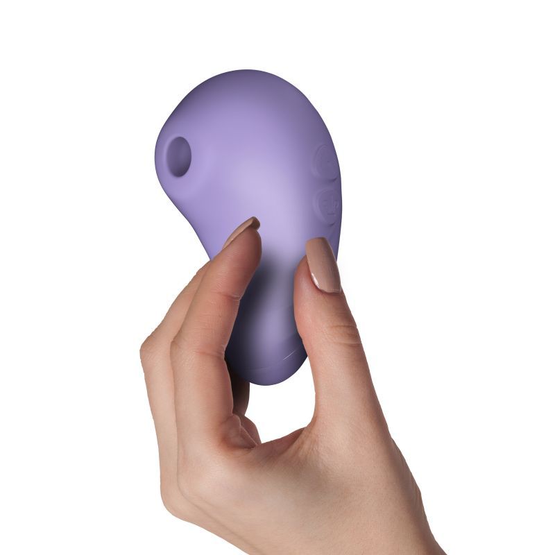 Suction vibrator lilac held in a hand, showcasing ergonomic design and easy-to-use features.