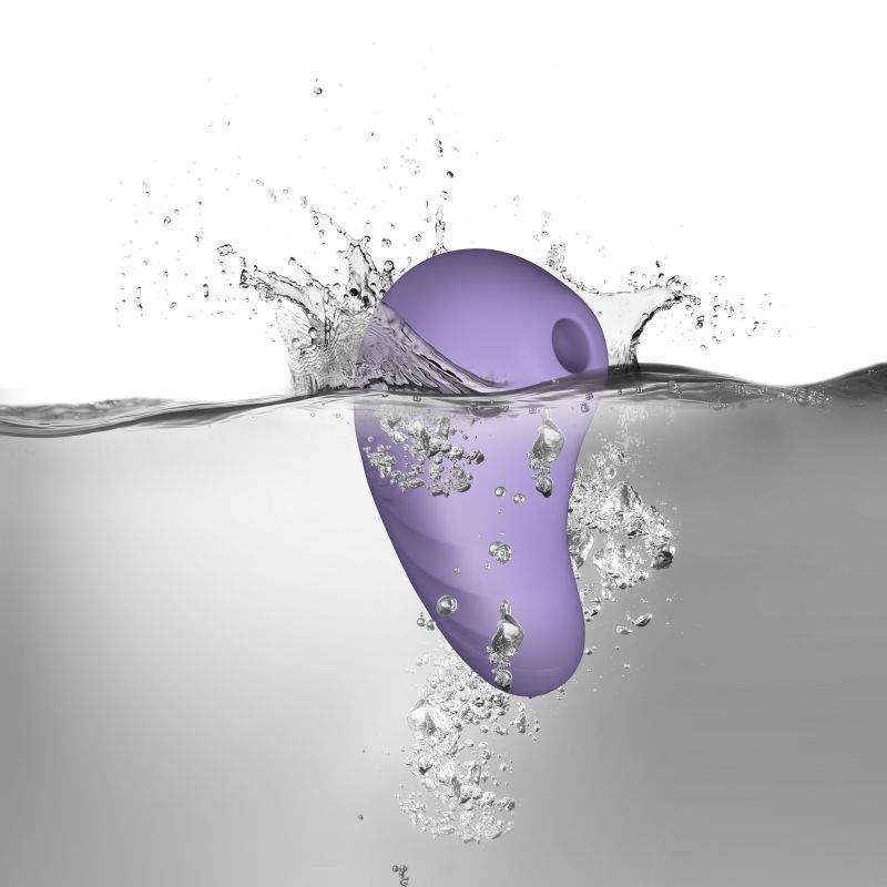 SugarBoo Peek A Boo suction vibrator lilac splashing in water, showcasing its waterproof design and ergonomic shape.