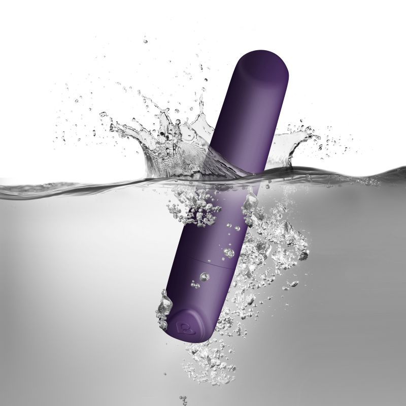 SugarBoo Damson wireless bullet vibrator maroon splashing in water showcasing waterproof feature.