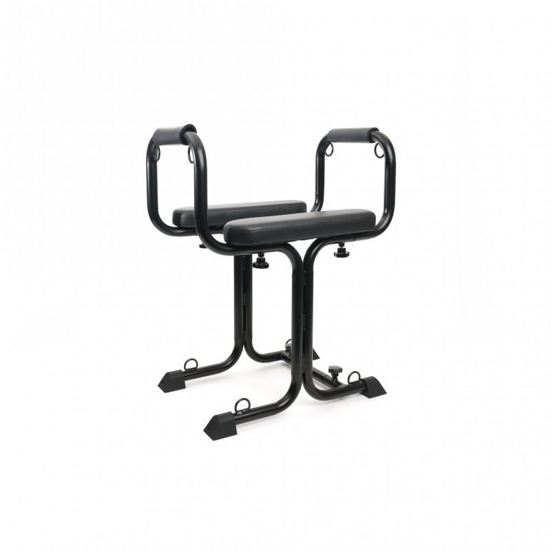 Versatile bondage love seat featuring padded armrests and adjustable frame for various positions.