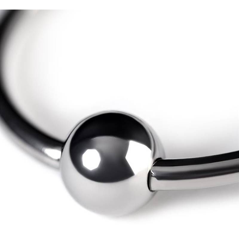 Close-up of a metal penis head ring 25mm with a shiny ball for enhanced stimulation.